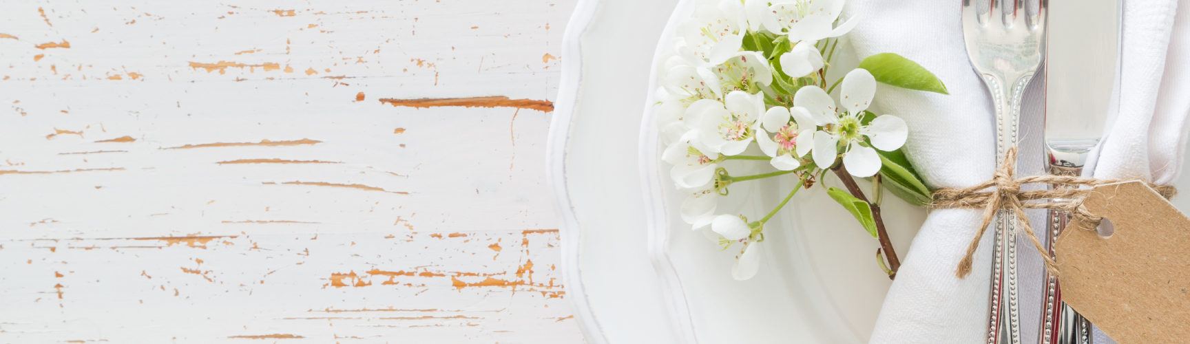 Spring table setting with white flowers, copy space