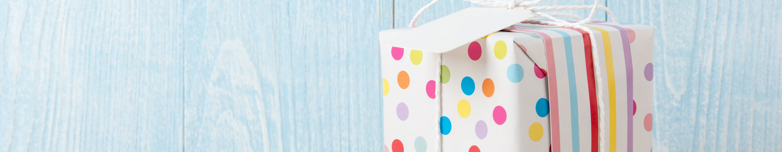 Polka dot gift box on wooden table